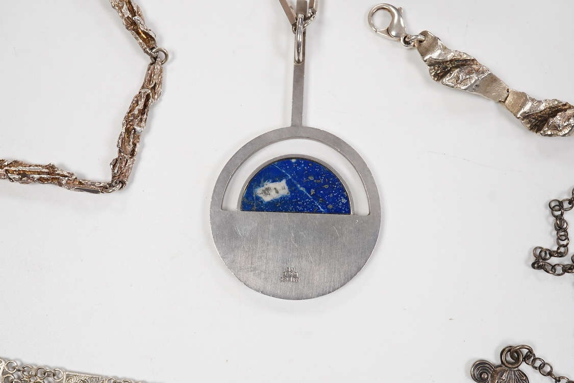 A collection of assorted jewellery including a stylish textured 925 necklace, 76cm and a similar bracelet, 18cm, a Portuguese white metal hinged bracelet, a white metal necklace with amberoid pendant, a white metal and g